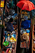 Thailand, Locals sell fruits, food and products at Damnoen Saduak floating market near Bangkok 